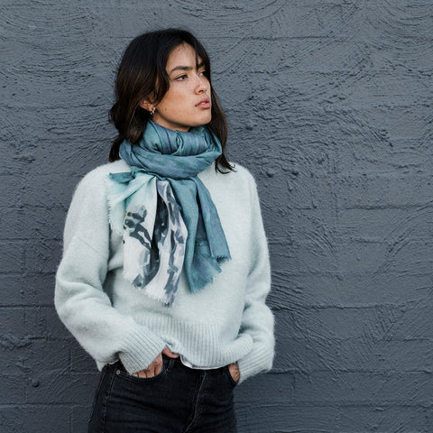 girl wearing jumper and surfers merino wool scarf tied around neck